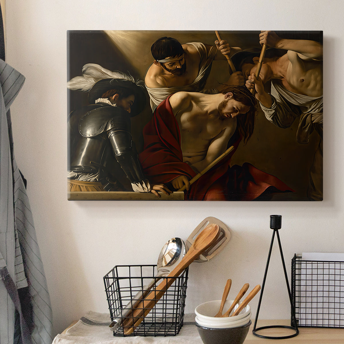Canvas art print detailing an intense religious composition with strong shadow and physical struggle, displayed in a softly lit workspace setting