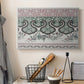 Canvas art print detailing a textile-style design with repeating curved and linear shapes, displayed in a softly lit workspace setting