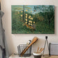 Canvas art print detailing a stylized jungle scene with animals in conflict, displayed in a softly lit workspace setting