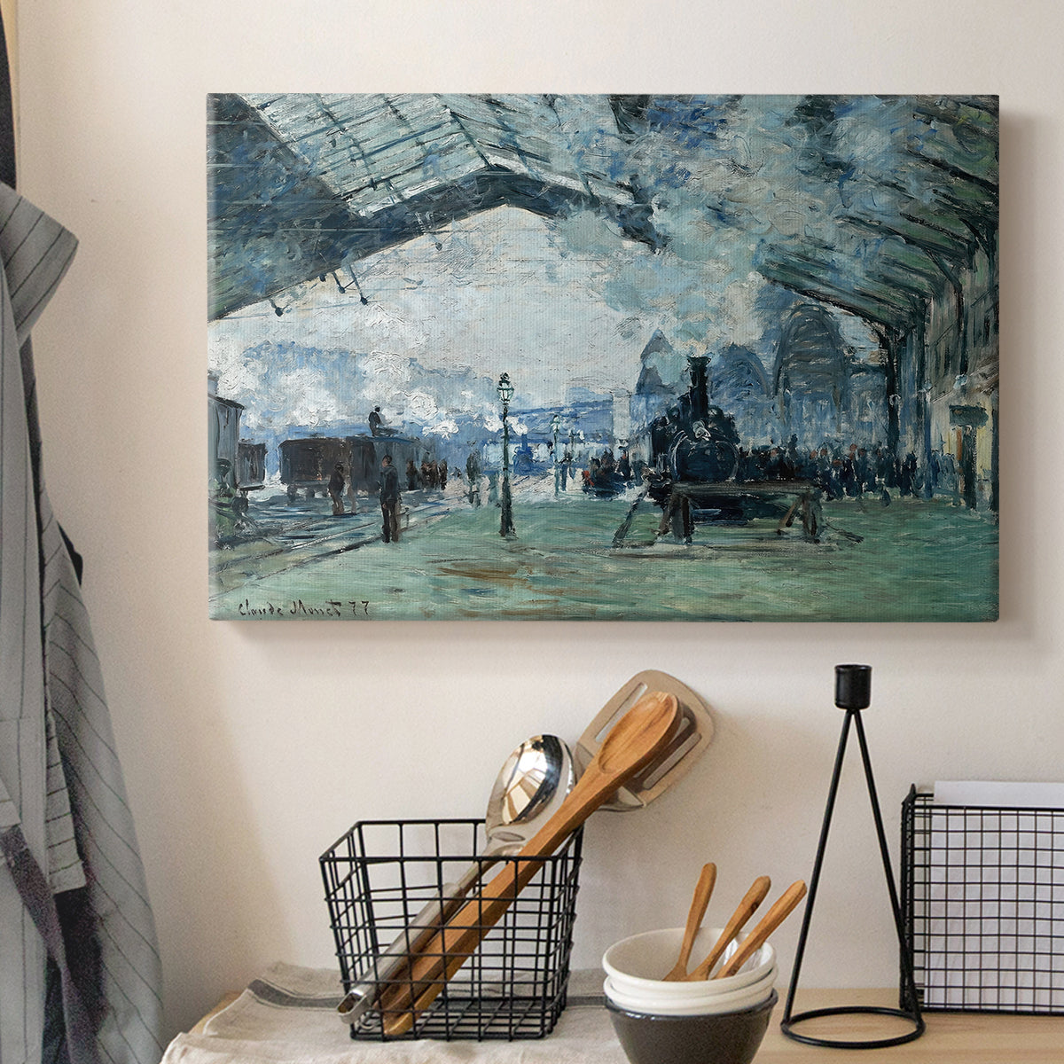 Canvas art print detailing a dramatic depiction of industrial space with trains and light, displayed in a softly lit workspace setting