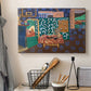 Canvas art print detailing a stylized room composition featuring aubergines on a table, displayed in a softly lit workspace setting