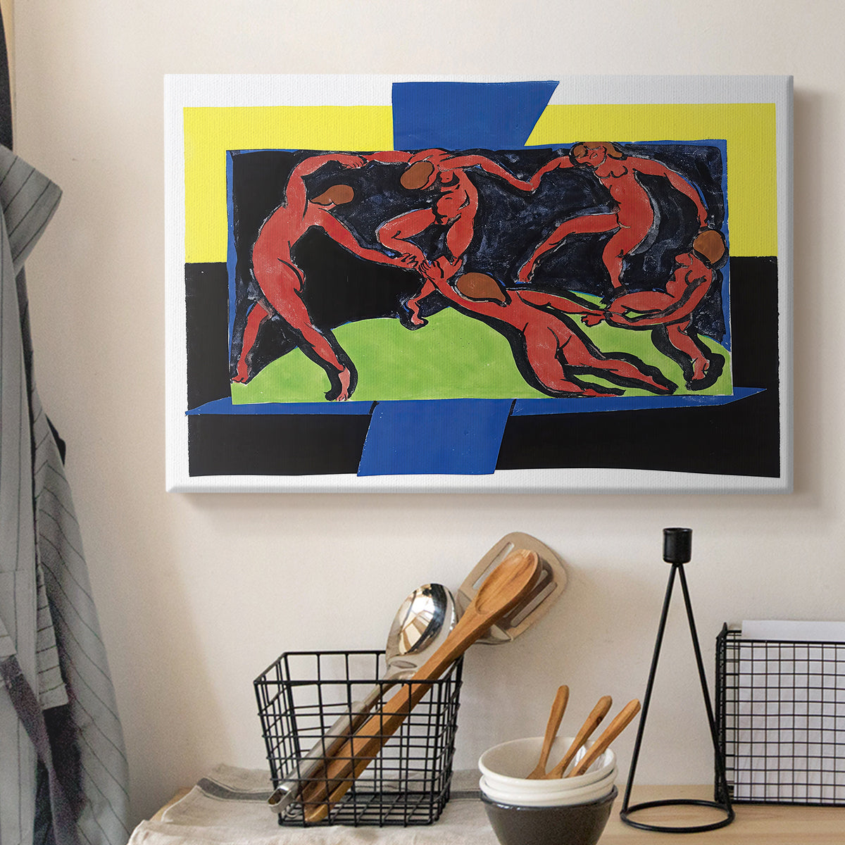 Canvas art print detailing a stylized depiction of human figures dancing in unity, displayed in a softly lit workspace setting
