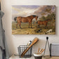 Canvas art print detailing a countryside scene featuring grouped horses, displayed in a softly lit workspace setting