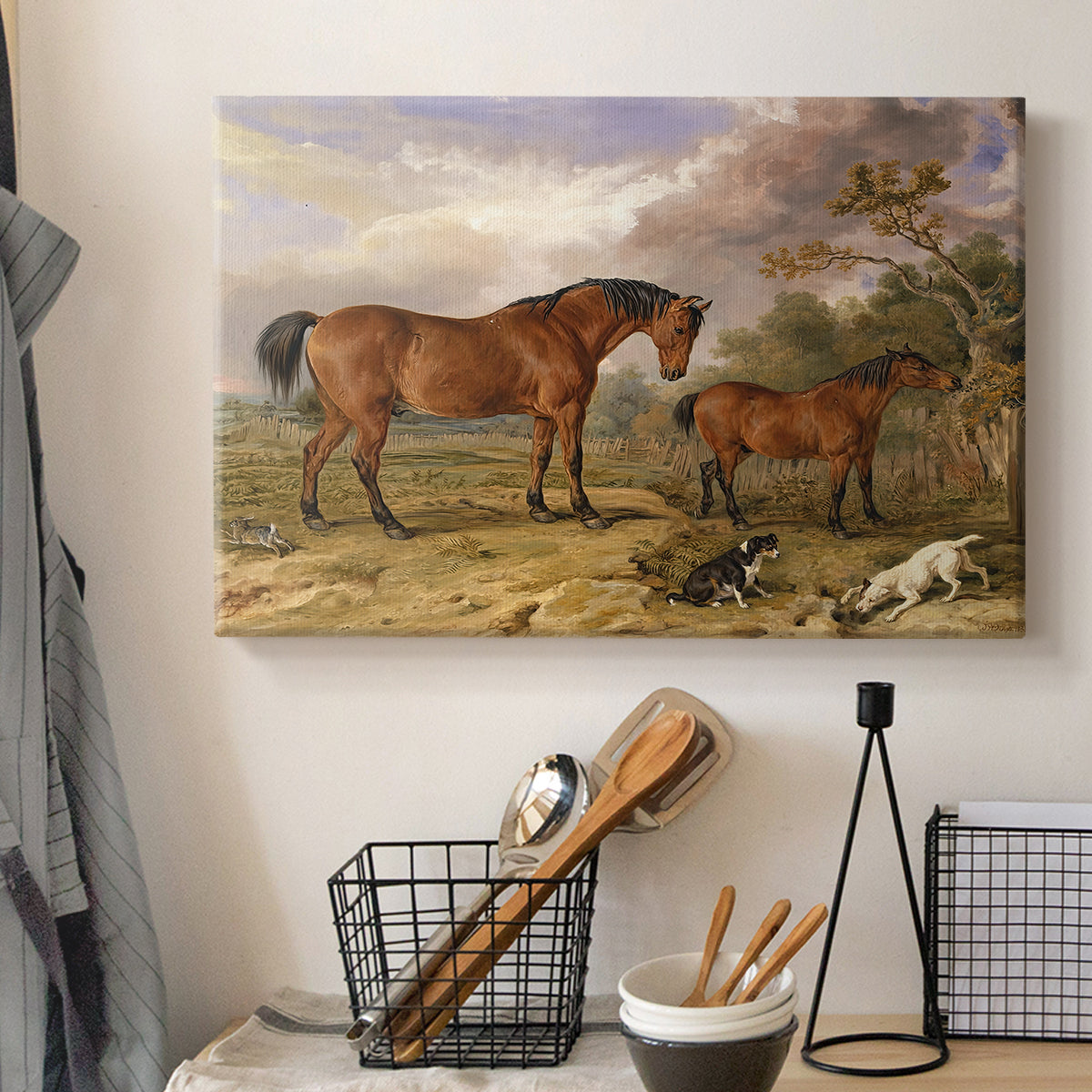 Canvas art print detailing a countryside scene featuring grouped horses, displayed in a softly lit workspace setting