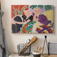 Canvas art print detailing a stylized depiction of a conversation in a colorful room, displayed in a softly lit workspace setting
