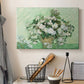 Canvas art print detailing a stylized botanical scene with soft tones, displayed in a softly lit workspace setting
