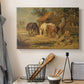 Canvas art print detailing a rustic depiction of animals grouped around food, displayed in a softly lit workspace setting