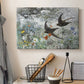 Canvas art print detailing an impressionist wildlife scene capturing birds in motion, displayed in a softly lit workspace setting