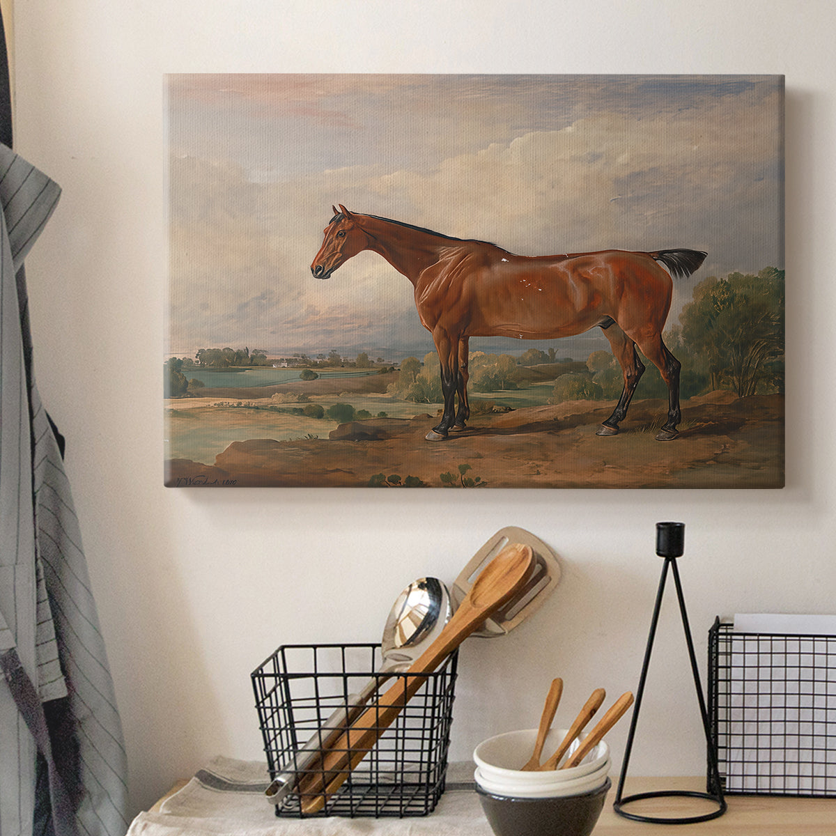 Canvas art print detailing a rural setting with figure and horse, displayed in a softly lit workspace setting