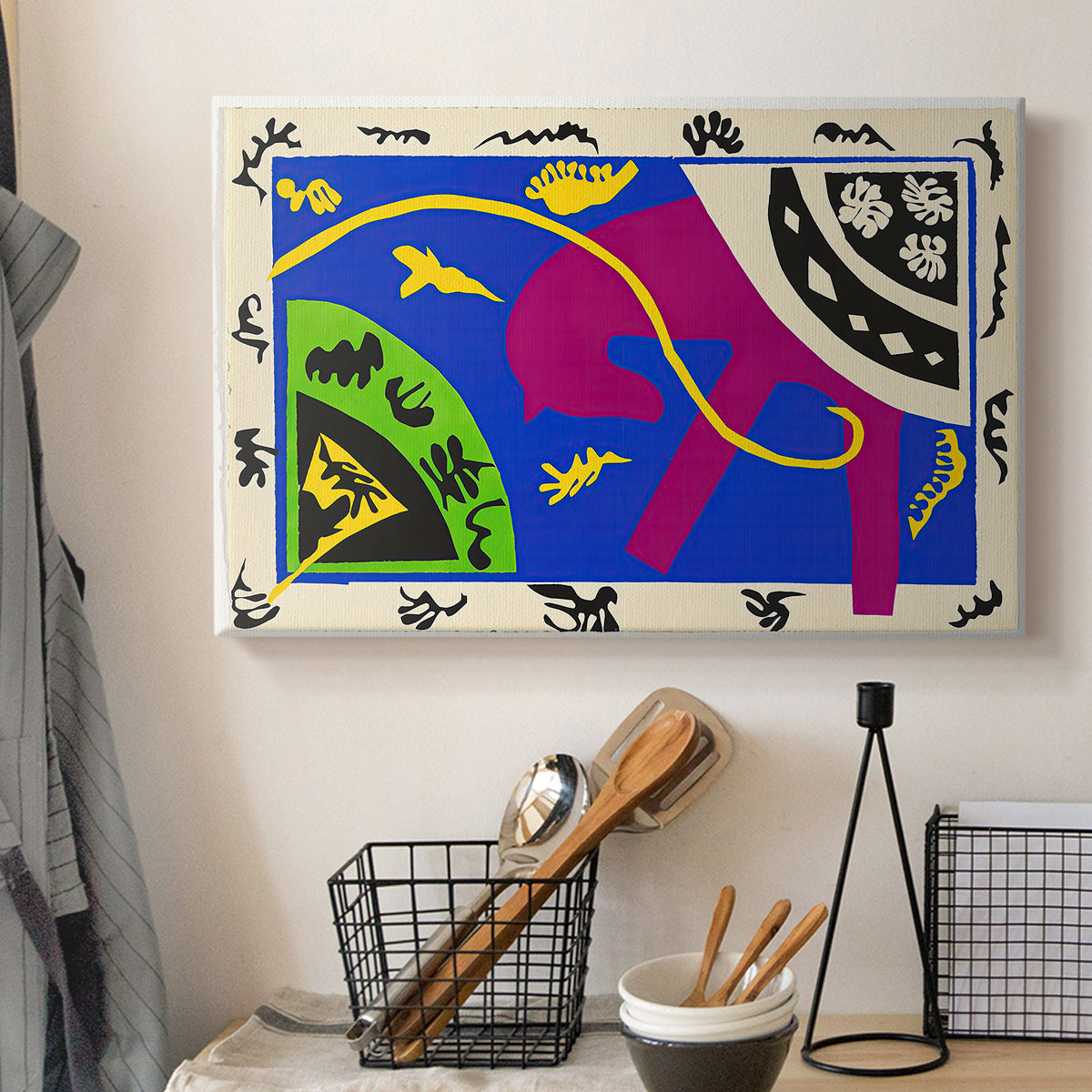 Canvas art print detailing a stylized arrangement of horse and human forms, displayed in a softly lit workspace setting