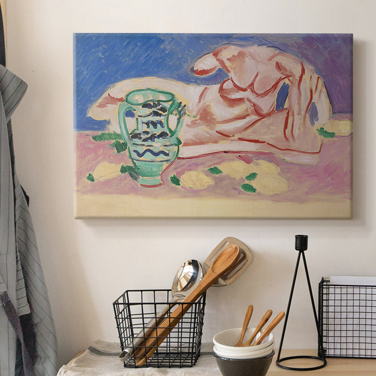 Canvas art print detailing a stylized figure study with decorative color blocks, displayed in a softly lit workspace setting
