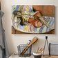 Canvas art print detailing an expressive interior scene with a lounging woman, displayed in a softly lit workspace setting