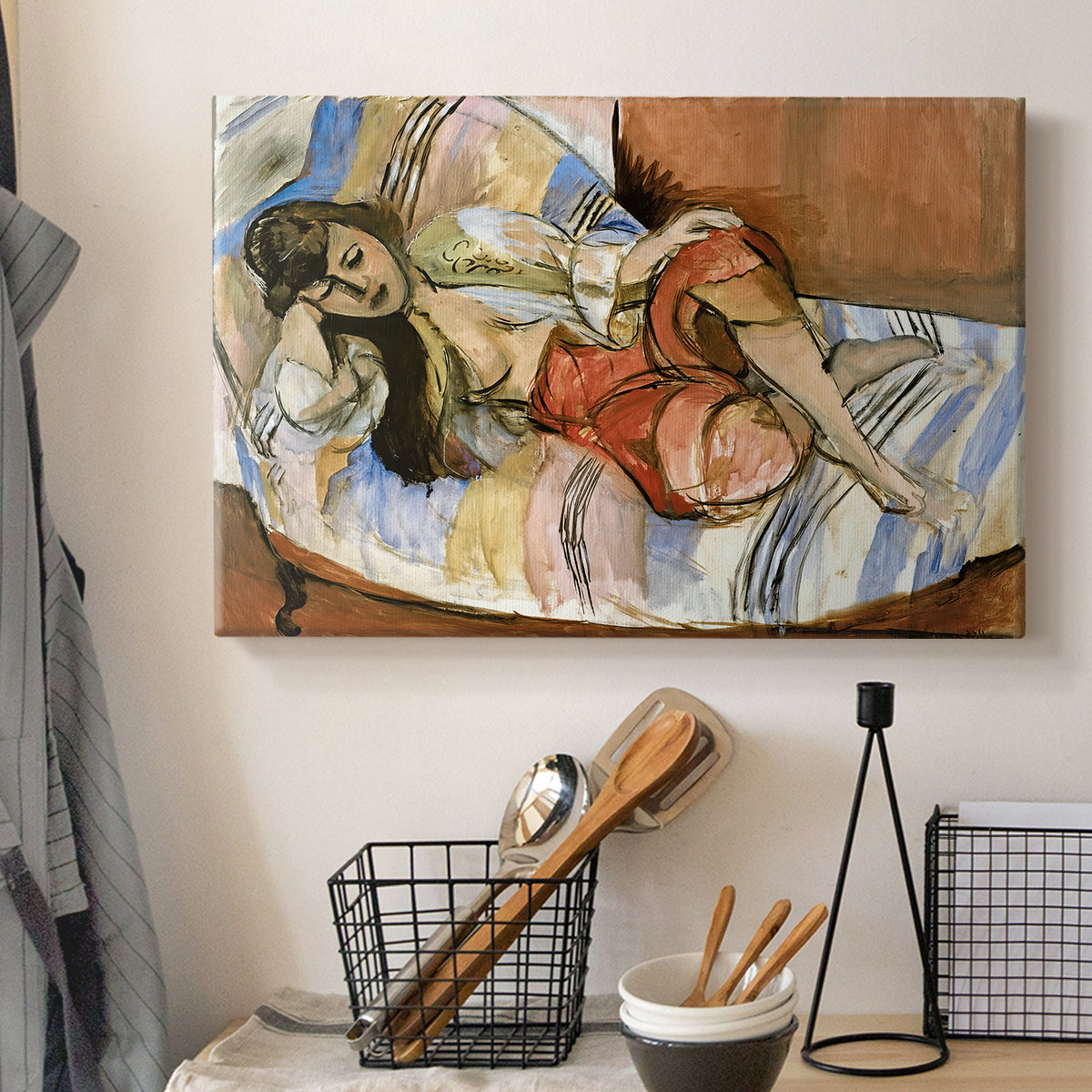 Canvas art print detailing an expressive interior scene with a lounging woman, displayed in a softly lit workspace setting