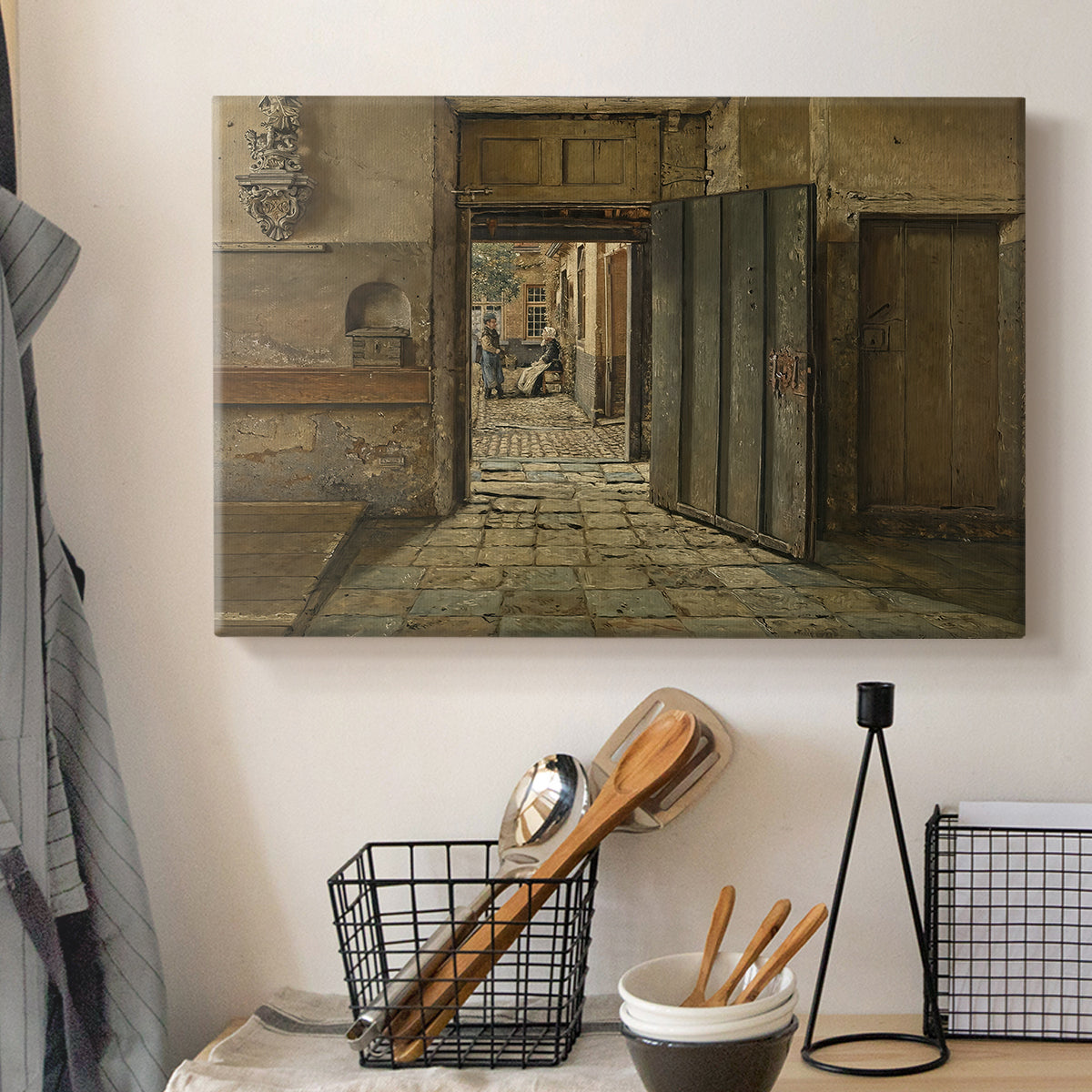 Canvas art print detailing an interior setting with figures positioned near doorway, displayed in a softly lit workspace setting