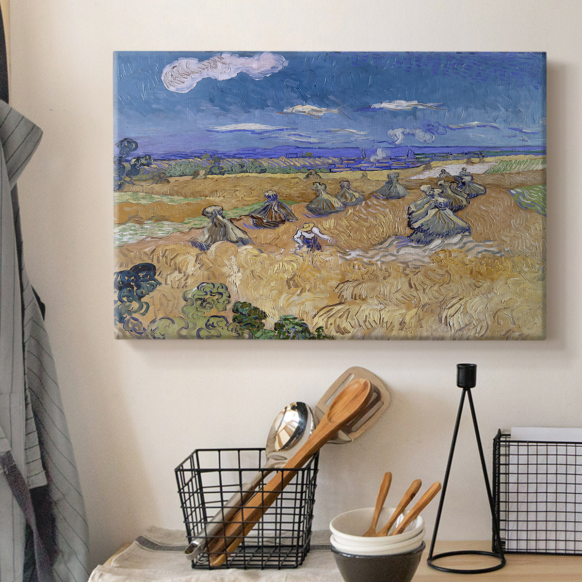 Canvas art print detailing a post-impressionist composition with field and worker, displayed in a softly lit workspace setting