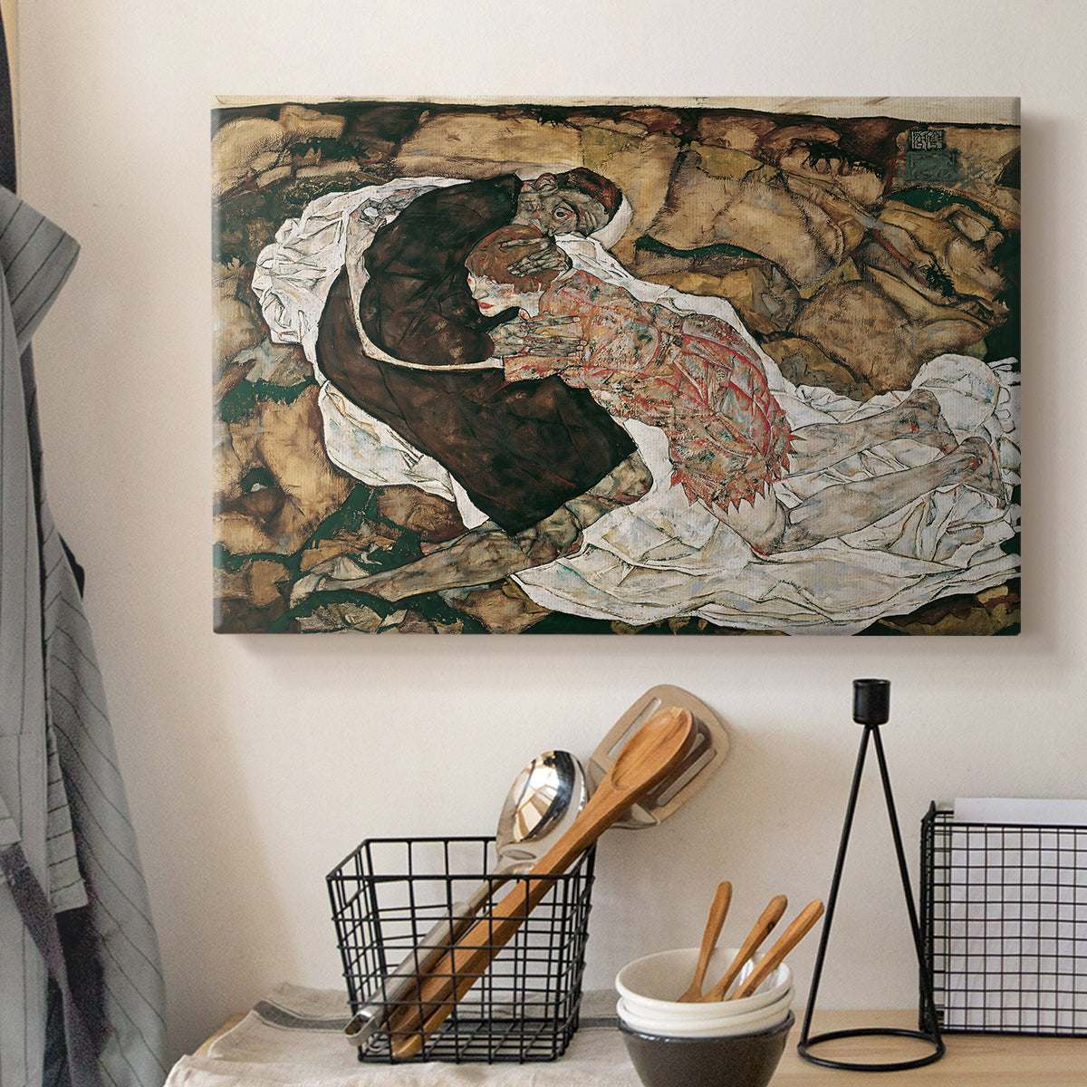 Canvas art print detailing an intense composition exploring life and death through figures, displayed in a softly lit workspace setting