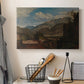 Canvas art print detailing a scenic mountain setting, displayed in a softly lit workspace setting