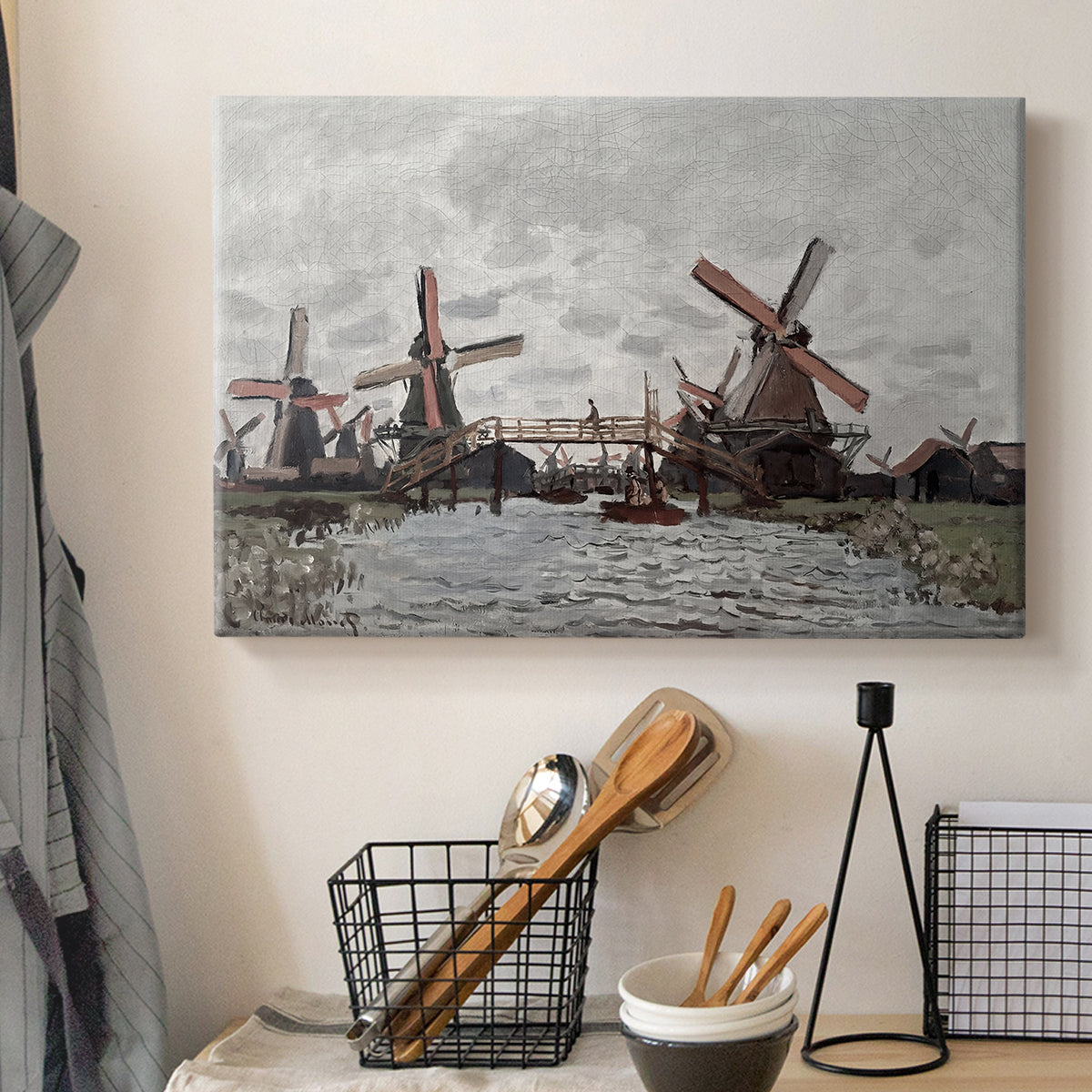 Canvas art print detailing a landscape featuring windmills and low horizon sky, displayed in a softly lit workspace setting