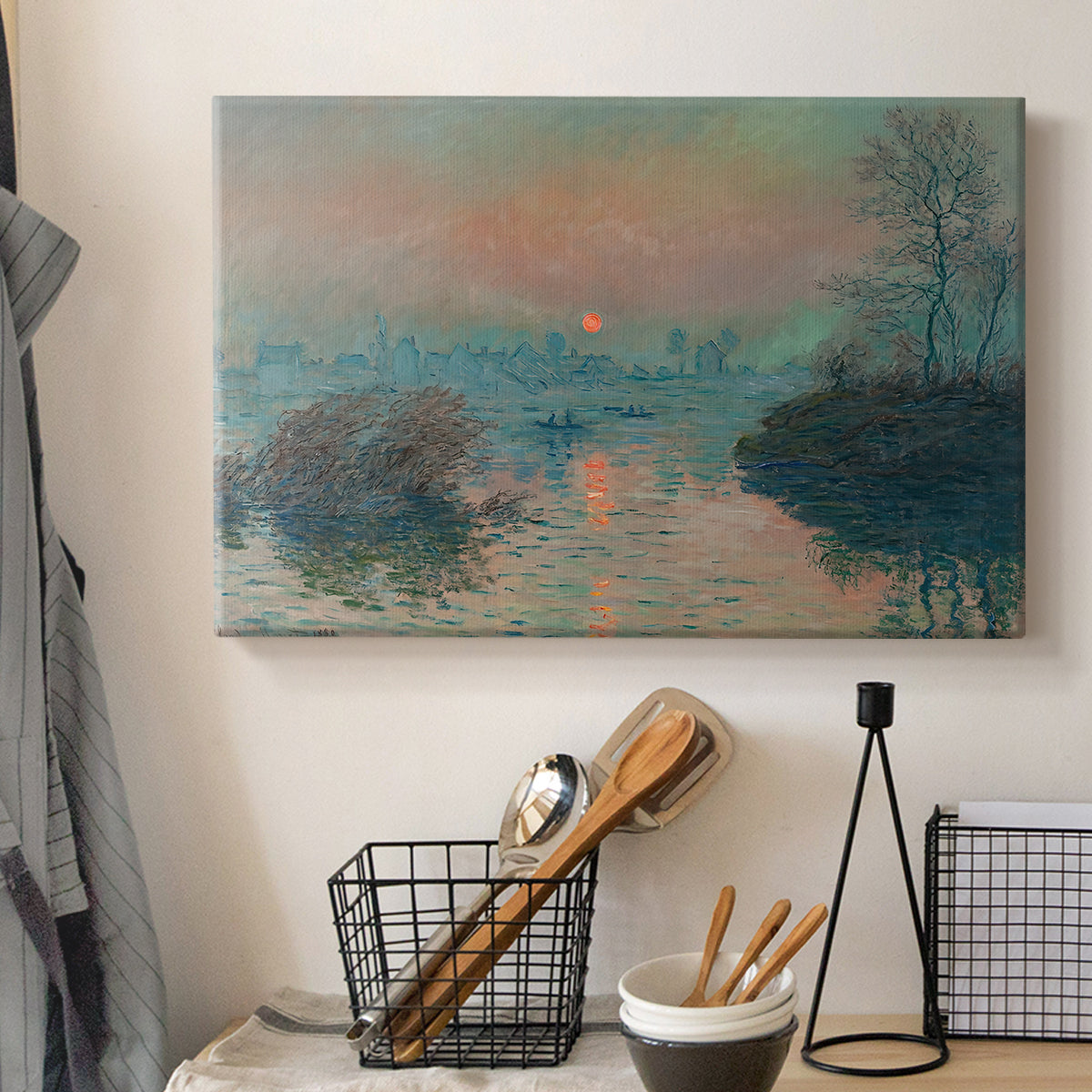 Canvas art print detailing an atmospheric landscape combining cold tones and warm sky, displayed in a softly lit workspace setting