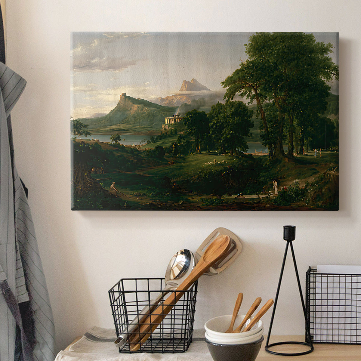 Canvas art print detailing a countryside composition showing harmony between people and land, displayed in a softly lit workspace setting