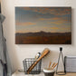 Canvas art print detailing a panoramic natural view with low mountains and open plain, displayed in a softly lit workspace setting