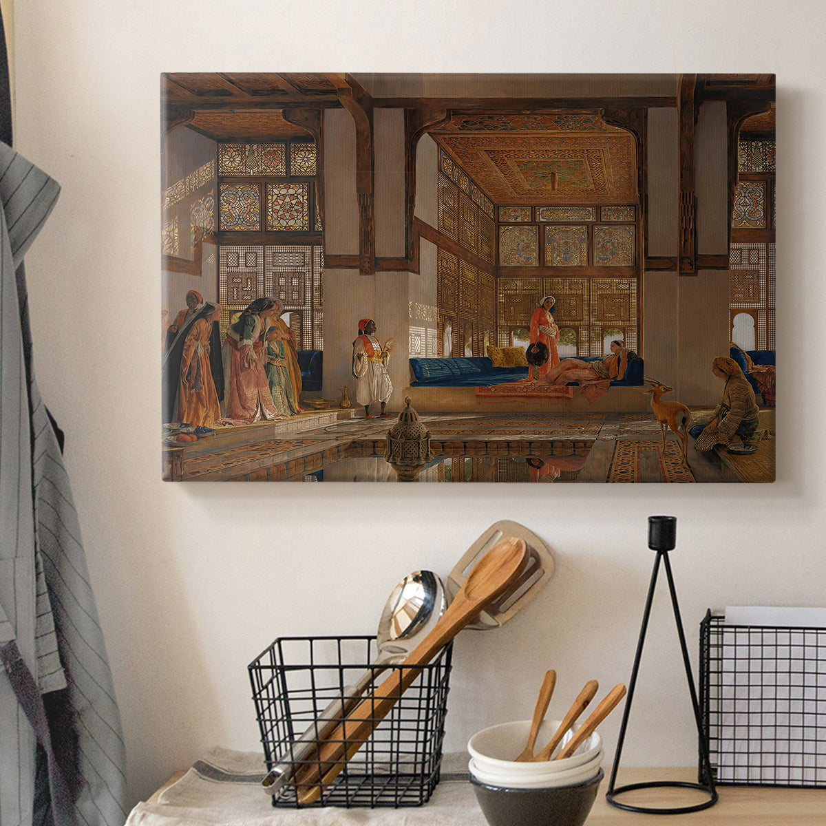 Canvas art print detailing a narrative scene of visitors gathered around central figure, displayed in a softly lit workspace setting