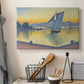 Canvas art print detailing a maritime light scene, displayed in a softly lit workspace setting