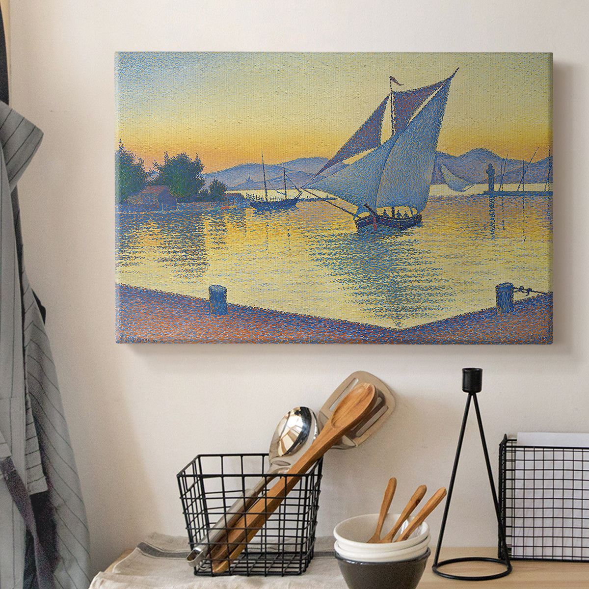 Canvas art print detailing a maritime light scene, displayed in a softly lit workspace setting