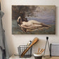 Canvas art print detailing a romantic scene combining human figure and shoreline, displayed in a softly lit workspace setting