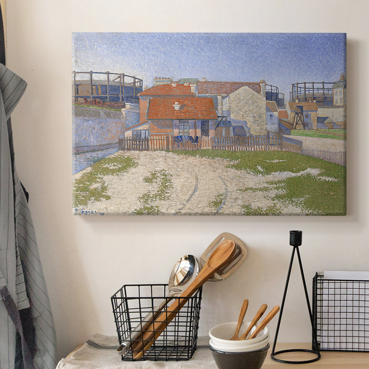 Canvas art print detailing an urban composition with structures, displayed in a softly lit workspace setting