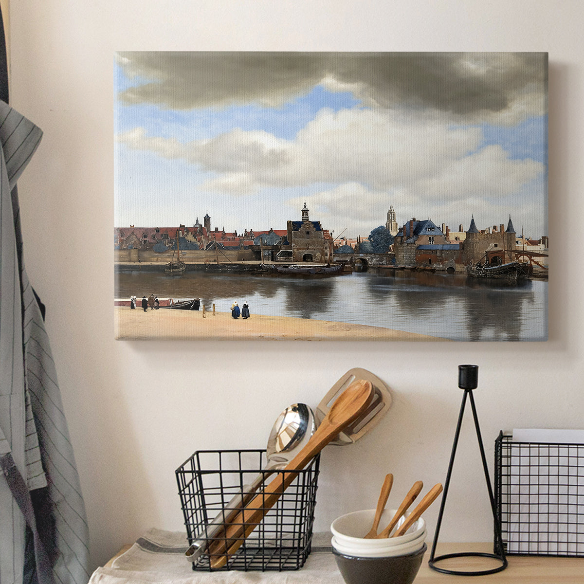 Canvas art print detailing a panoramic town scene with skyline, displayed in a softly lit workspace setting