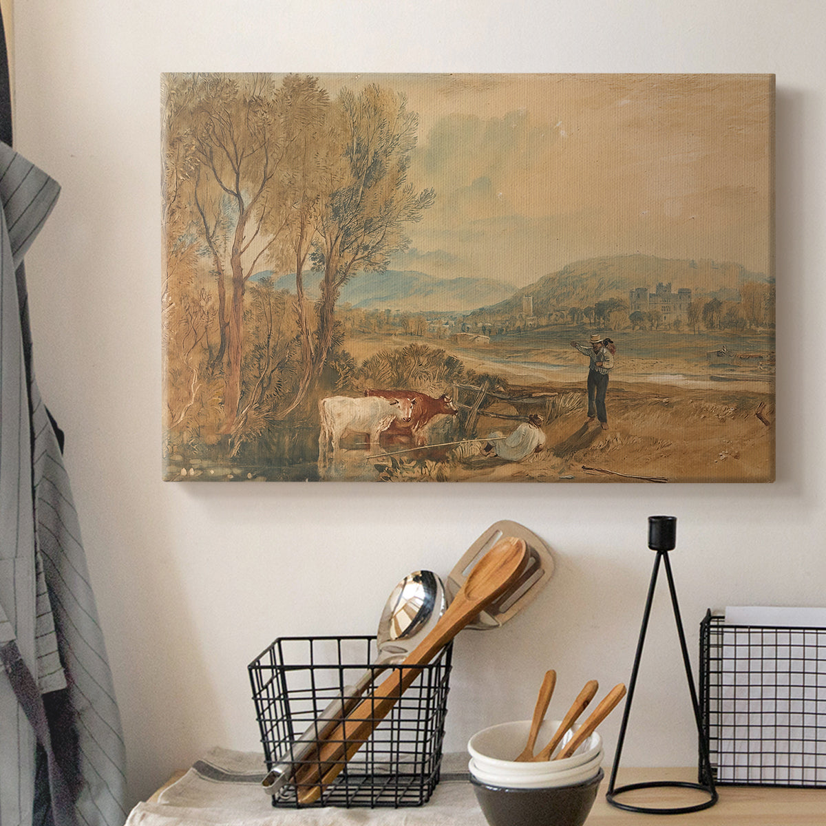 Canvas art print detailing a landscape featuring castle, displayed in a softly lit workspace setting