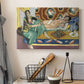 Canvas art print detailing a stylized domestic scene with women and checkers, displayed in a softly lit workspace setting