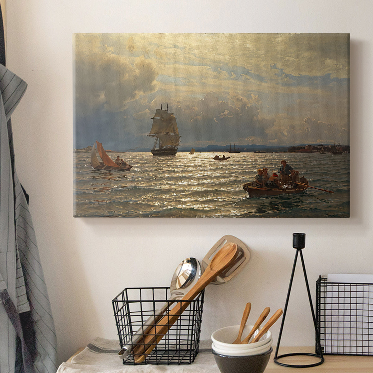 Canvas art print detailing a scenic waterfront view with gentle sky and shoreline, displayed in a softly lit workspace setting