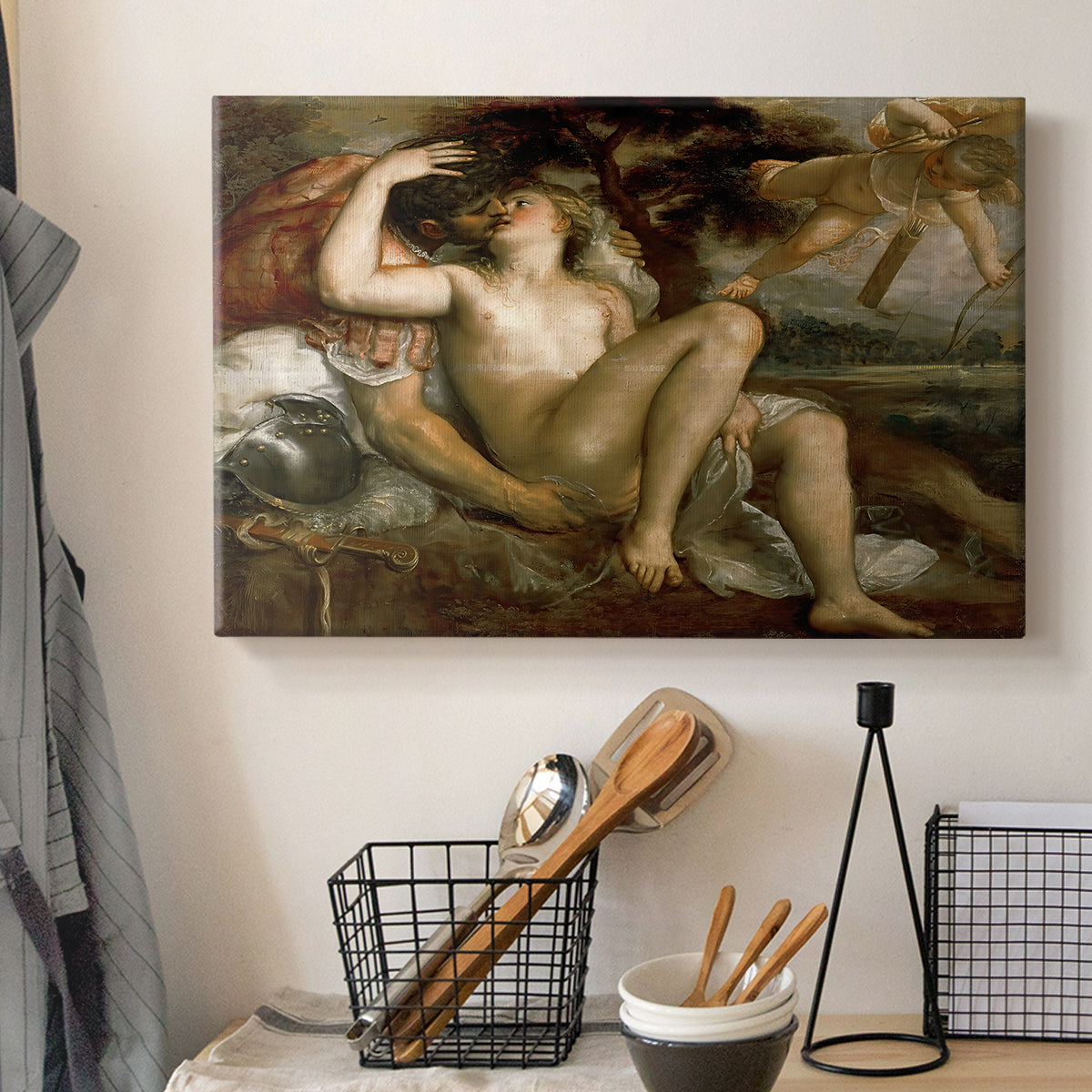 Canvas art print detailing a classical figure scene featuring Venus, Mars, and Cupid, displayed in a softly lit workspace setting