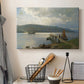 Canvas art print detailing a seaside setting with jetty and quiet water, displayed in a softly lit workspace setting