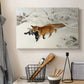 Canvas art print detailing a dynamic depiction of animal in cold snowy environment, displayed in a softly lit workspace setting