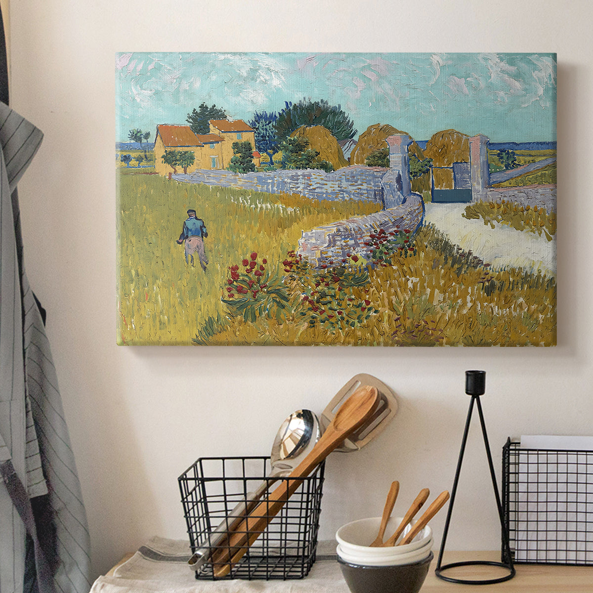 Canvas art print detailing a landscape centered on structure within bright field, displayed in a softly lit workspace setting