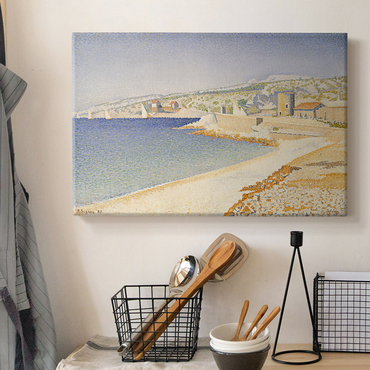 Canvas art print detailing a landscape with jetty, displayed in a softly lit workspace setting