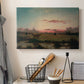 Canvas art print detailing a peaceful marsh setting, displayed in a softly lit workspace setting