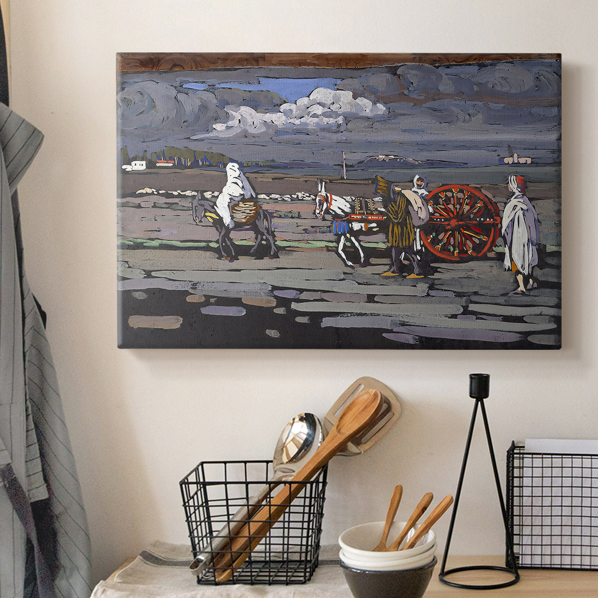 Canvas art print detailing a stylized rural setting with strong color contrasts, displayed in a softly lit workspace setting