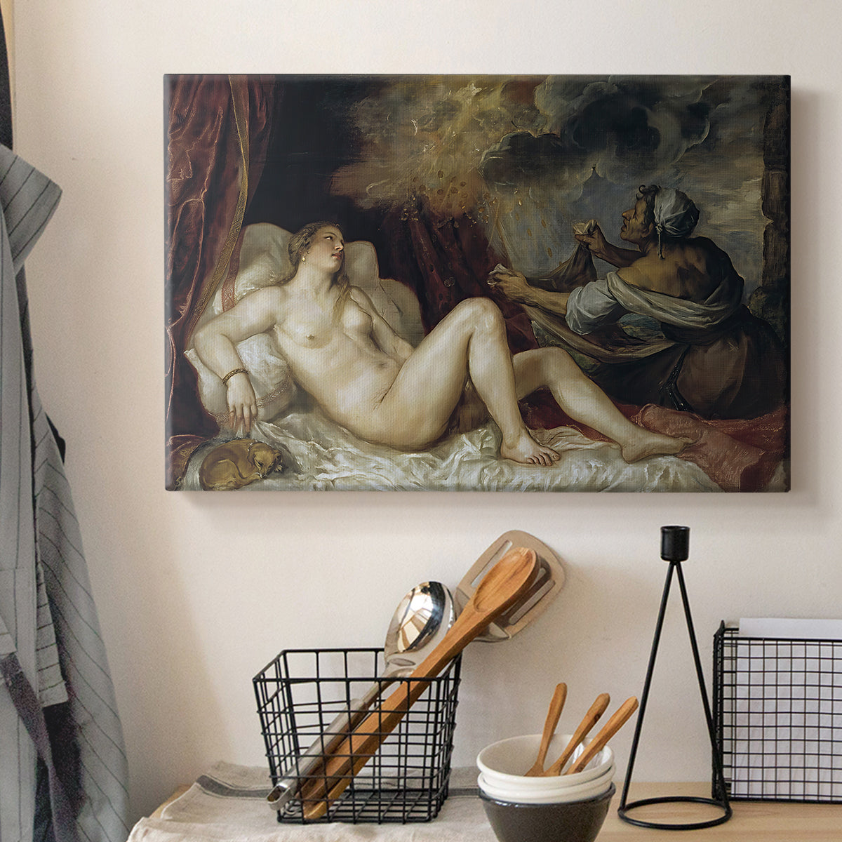 Canvas art print detailing a mythological interior with resting figure and surrounding fabrics, displayed in a softly lit workspace setting