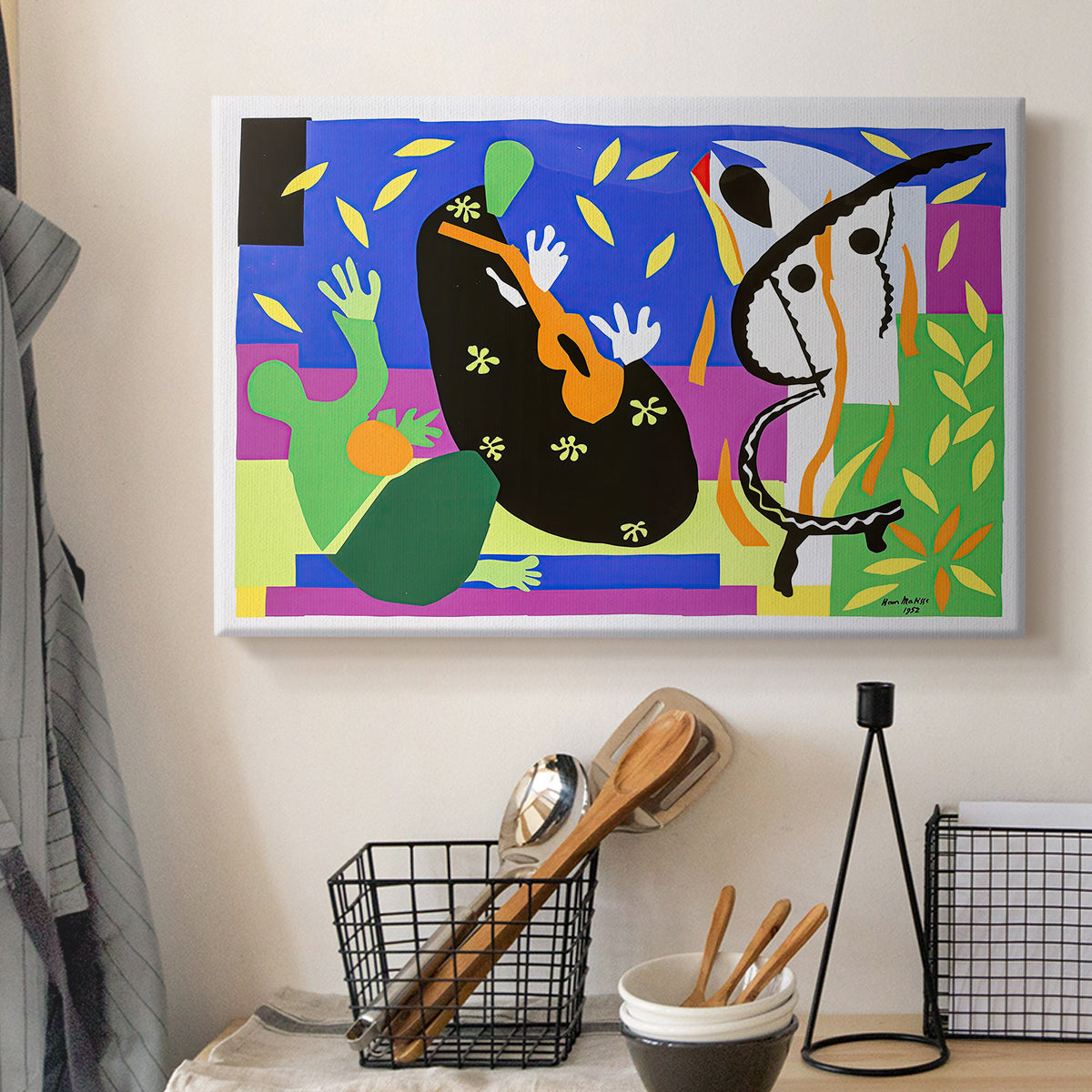 Canvas art print detailing a stylized composition of human forms, displayed in a softly lit workspace setting