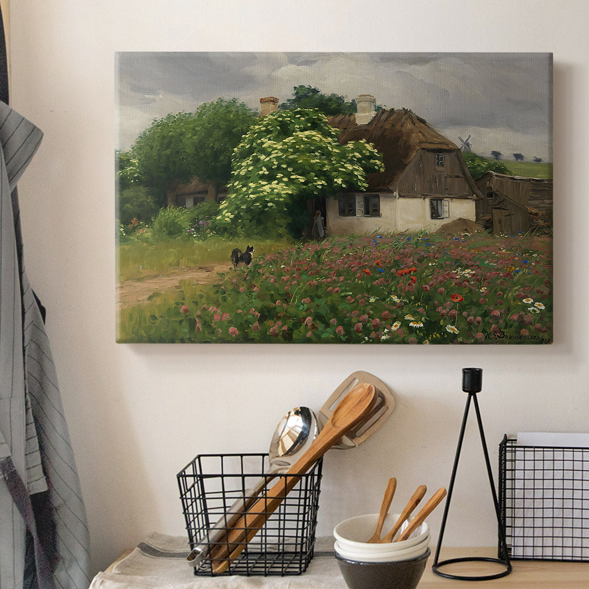 Canvas art print detailing a peaceful farmhouse view with natural vegetation, displayed in a softly lit workspace setting