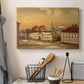 Canvas art print detailing a detailed depiction of historic site with figures in motion, displayed in a softly lit workspace setting