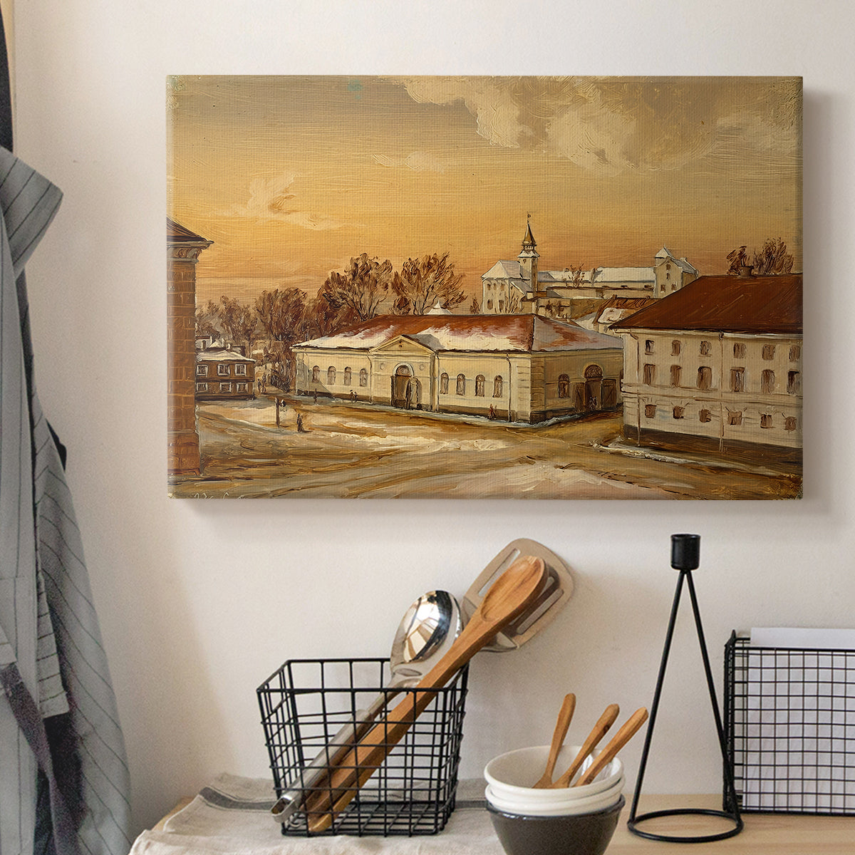 Canvas art print detailing a detailed depiction of historic site with figures in motion, displayed in a softly lit workspace setting