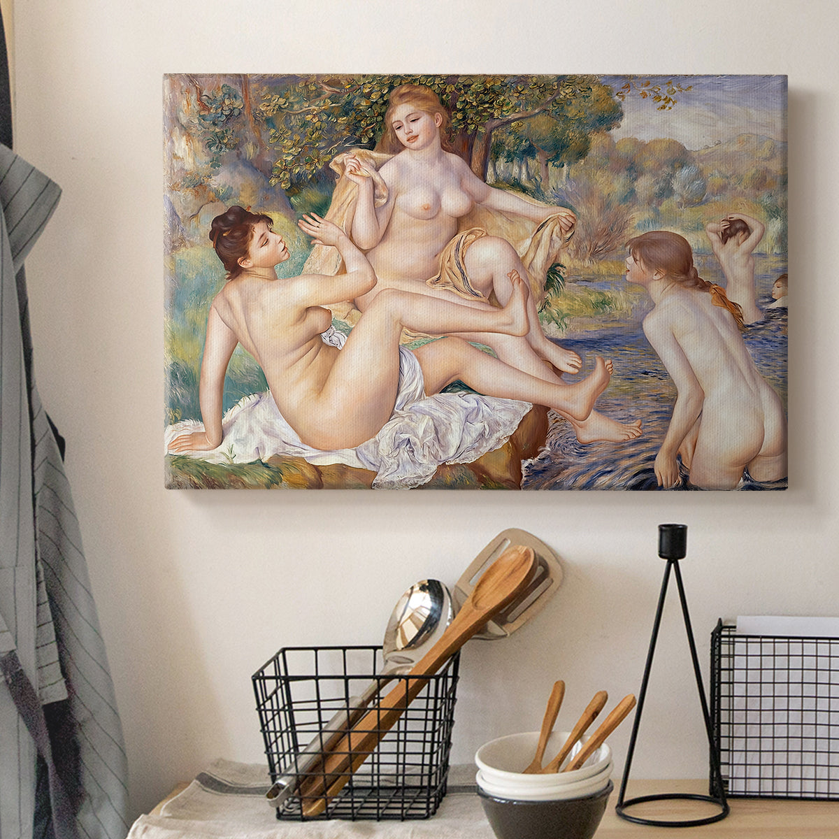 Canvas art print detailing women bathing in nature surrounded by trees and soft light, displayed in a softly lit workspace setting