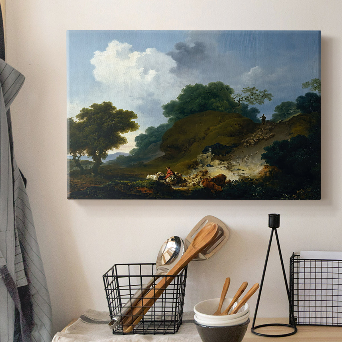 Canvas art print detailing a pastoral composition featuring livestock and terrain, displayed in a softly lit workspace setting