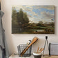 Canvas art print detailing a tranquil outdoor setting with washerwomen and river, displayed in a softly lit workspace setting