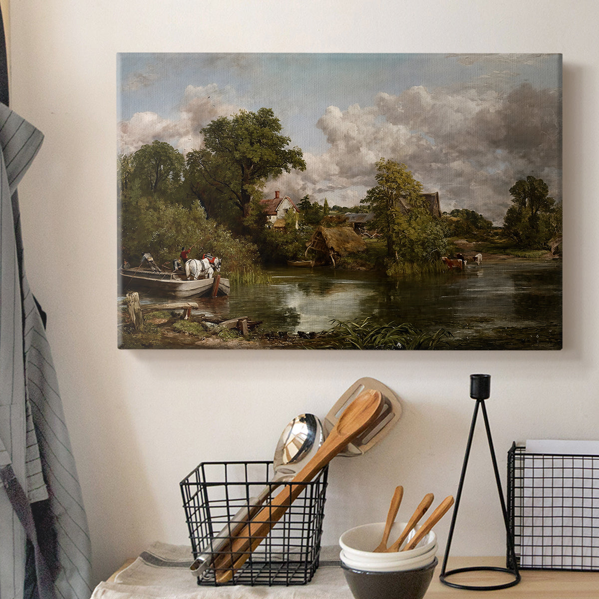 Canvas art print detailing a traditional rural composition with horse and trees, displayed in a softly lit workspace setting